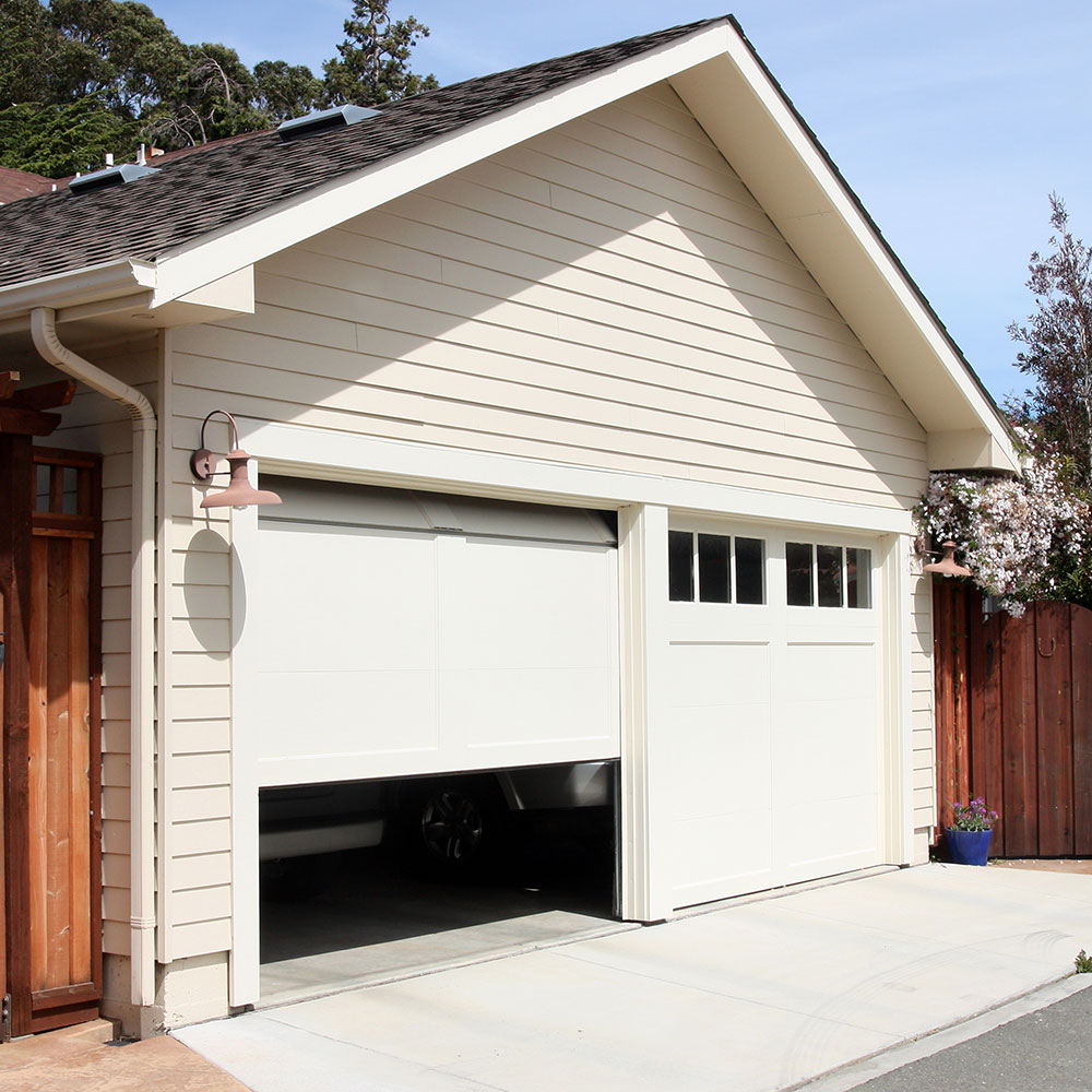 View of a garage with the door opening