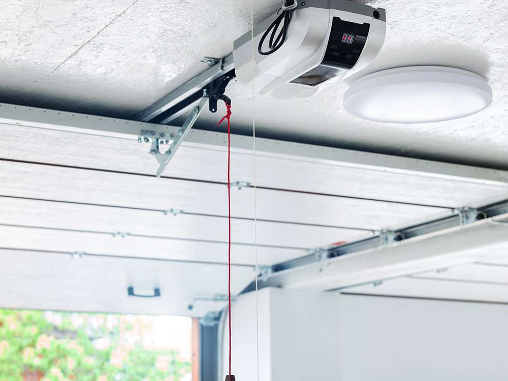 a garage door opener attached to a ceiling