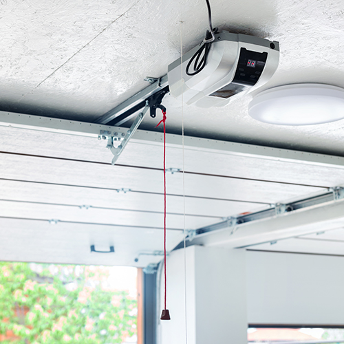 a garage door opener attached to a ceiling