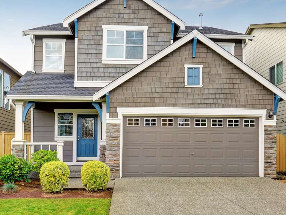 a person repairing a garage door a person repairing a garage door